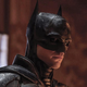 The Batman's Robert Pattinson poses stoically in the Batman suit.